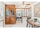 A view from the kitchen to the dining area showcases a lovely transition and ample storage at 3298 Quail St, Wheat Ridge, CO 80033