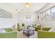Bright and airy living area featuring comfortable seating and neutral walls at 3298 Quail St, Wheat Ridge, CO 80033