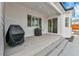 Covered patio area with outdoor grills, ideal for entertaining with easy access to the home at 1195 Melting Snow Way, Castle Rock, CO 80109