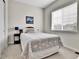 Simple bedroom featuring neutral paint, gray carpet, side table, and a double window at 1195 Melting Snow Way, Castle Rock, CO 80109