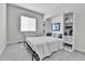 Cozy bedroom with built-in shelves and a window, offering a comfortable and organized space at 1195 Melting Snow Way, Castle Rock, CO 80109