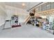 Organized garage featuring a functional loft storage space, work area, and storage solutions at 1195 Melting Snow Way, Castle Rock, CO 80109