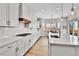 Modern kitchen with white cabinets, quartz countertops, and stainless steel appliances at 1195 Melting Snow Way, Castle Rock, CO 80109