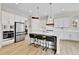 Stylish kitchen featuring a center island with seating, stainless steel appliances, and sleek cabinetry at 1195 Melting Snow Way, Castle Rock, CO 80109