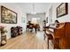 Open living room featuring pianos, recessed lighting, neutral paint, wood floors, and large art pieces at 1195 Melting Snow Way, Castle Rock, CO 80109