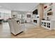 Bright and open living room with fireplace, large windows, and neutral decor at 1195 Melting Snow Way, Castle Rock, CO 80109