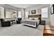 Bright main bedroom featuring bay windows, sitting area, gray carpet and charming decor at 1195 Melting Snow Way, Castle Rock, CO 80109