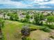 Drone shot of a property with an abundance of green space and a distant mountain view at 1961 S Xenia Ct, Denver, CO 80231