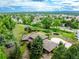 An elevated view of a home showcasing mature trees and beautiful landscaping at 1961 S Xenia Ct, Denver, CO 80231