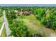 Aerial view of a lot with mature trees and a home on the property at 1961 S Xenia Ct, Denver, CO 80231