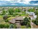 An aerial shot of a neighborhood featuring a home nestled among lush greenery and mature trees at 1961 S Xenia Ct, Denver, CO 80231