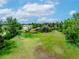 Scenic view of a home situated on a property with mature landscaping at 1961 S Xenia Ct, Denver, CO 80231
