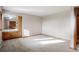 A spacious bedroom with light-colored walls and floors, built-in sink vanity, and ample natural light at 1961 S Xenia Ct, Denver, CO 80231