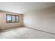 This bright bedroom has natural light, neutral paint, wood trim and carpet flooring at 1961 S Xenia Ct, Denver, CO 80231