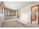 Sunlit bedroom with large windows and easy access to the attached bathroom at 1961 S Xenia Ct, Denver, CO 80231