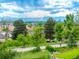 Neighborhood street view of homes with scenic mountain views in the distance at 1961 S Xenia Ct, Denver, CO 80231