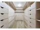 Organized walk-in closet with ample shelving and drawer space at 1961 S Xenia Ct, Denver, CO 80231