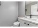 A modern bathroom showcases a sleek vanity, a toilet, and updated fixtures at 11716 Fairplay St, Commerce City, CO 80603