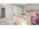 Bright bedroom with a decorative bed frame, soft carpet, and a large closet with sliding doors at 11716 Fairplay St, Commerce City, CO 80603