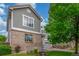 Well-maintained home with brick and siding exterior, accented by a mature shade tree at 11716 Fairplay St, Commerce City, CO 80603