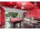 This converted garage features a bar, pool table, and entertainment area, offering a unique recreational space at 11716 Fairplay St, Commerce City, CO 80603