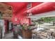Finished garage with custom bar, pool table, and seating area for entertaining or relaxing at 11716 Fairplay St, Commerce City, CO 80603