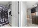 Hallway view through a partially open door to a bathroom and a bedroom in the background at 11716 Fairplay St, Commerce City, CO 80603