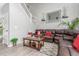 Living room with high ceilings, staircase, modern decor and oversized leather sofa at 11716 Fairplay St, Commerce City, CO 80603