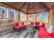 Enjoy outdoor living with a covered patio, comfortable seating, and a stone fire pit for relaxing evenings at 11716 Fairplay St, Commerce City, CO 80603