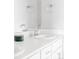 Bright bathroom vanity features a sleek white countertop, modern fixtures, and ample storage space at 5099 S Robb St, Littleton, CO 80127