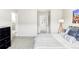 Inviting bedroom features a soft carpet, a full bed with decorative pillows, and an open view of the hall at 5099 S Robb St, Littleton, CO 80127