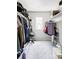 Spacious walk-in closet with organized clothing racks, shelving, and natural light from the window offers ample storage at 5099 S Robb St, Littleton, CO 80127
