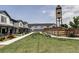 Well-maintained community with lush green spaces, walkways, townhomes, and attractive landscaping at 5099 S Robb St, Littleton, CO 80127