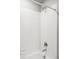 Clean shower with chrome fixtures, white tiled walls, and a convenient soap dish at 5099 S Robb St, Littleton, CO 80127