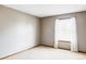 Neutral-toned bedroom with carpeted floor and a window with blinds at 5451 S Zinnia Ct, Littleton, CO 80127