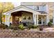 Covered patio with seating area and brick flooring at 5451 S Zinnia Ct, Littleton, CO 80127