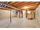 Unfinished basement with high ceilings and ample storage space at 6250 S Windermere St, Littleton, CO 80120