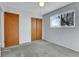 Cozy bedroom with wood door and neutral wall color at 6250 S Windermere St, Littleton, CO 80120