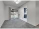 Inviting living room featuring neutral carpet, and sliding glass doors with access to a covered outdoor patio at 6250 S Windermere St, Littleton, CO 80120