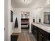 Bathroom showcasing double sinks with granite counters and a view into the bedroom at 5358 Ventura St, Denver, CO 80249