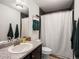 Functional bathroom with a shower, vanity, and coordinated towel arrangement for a clean aesthetic at 5358 Ventura St, Denver, CO 80249