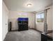 Bright bedroom featuring an aquarium, a window with a view, and neutral decor at 5358 Ventura St, Denver, CO 80249