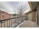 Balcony with metal railing overlooking street and condo buildings on a cloudy day at 4899 S Dudley St # 17G, Littleton, CO 80123