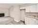 Kitchen leading to a carpeted living space with fireplace at 4899 S Dudley St # 17G, Littleton, CO 80123