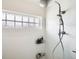 Bright shower with glass block window and modern fixtures at 18278 E Flora Pl # E, Aurora, CO 80013