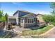 Backyard features a stone patio, wooden deck, and play area, perfect for Gathering activities at 20529 E Brunswick Pl, Aurora, CO 80013