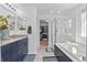 Bathroom with granite counters, a soaking tub, and a glass enclosed shower at 20529 E Brunswick Pl, Aurora, CO 80013