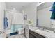 Well-maintained bathroom with a shower-tub combination, storage, and a granite-topped vanity at 20529 E Brunswick Pl, Aurora, CO 80013