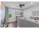 Cozy bedroom with natural light, a ceiling fan, closet space, and a reading nook at 20529 E Brunswick Pl, Aurora, CO 80013