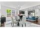 Open dining area with view of kitchen and large windows for natural light at 20529 E Brunswick Pl, Aurora, CO 80013